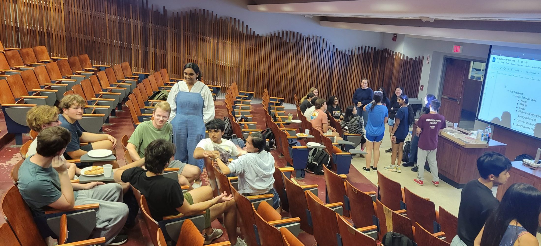 meeting and discussion in a lecture hall with the team