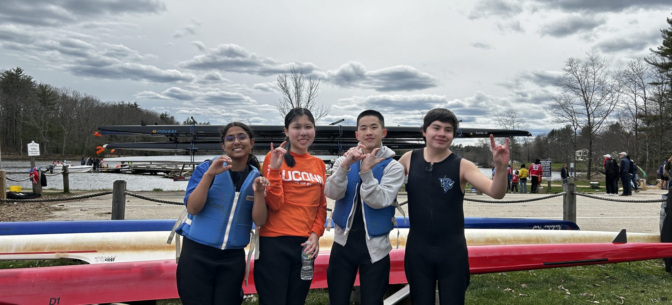 four team members ready and excited for rowing at the competition